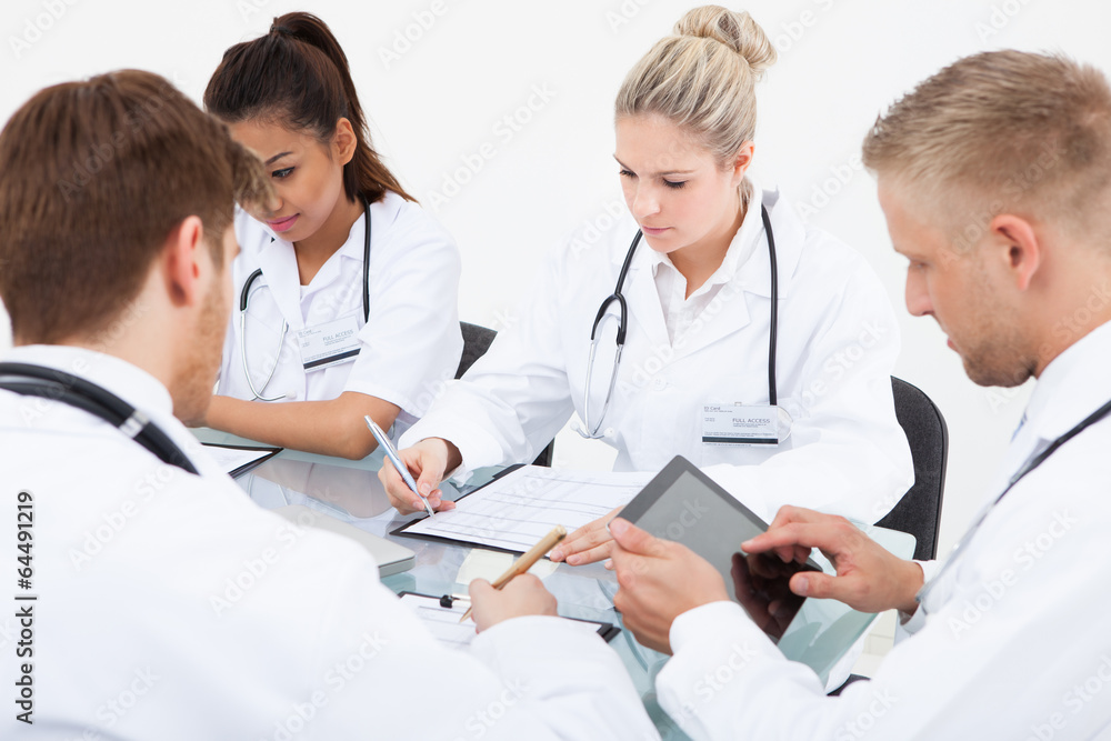 Doctors Working At Desk Doctors Working At Desk