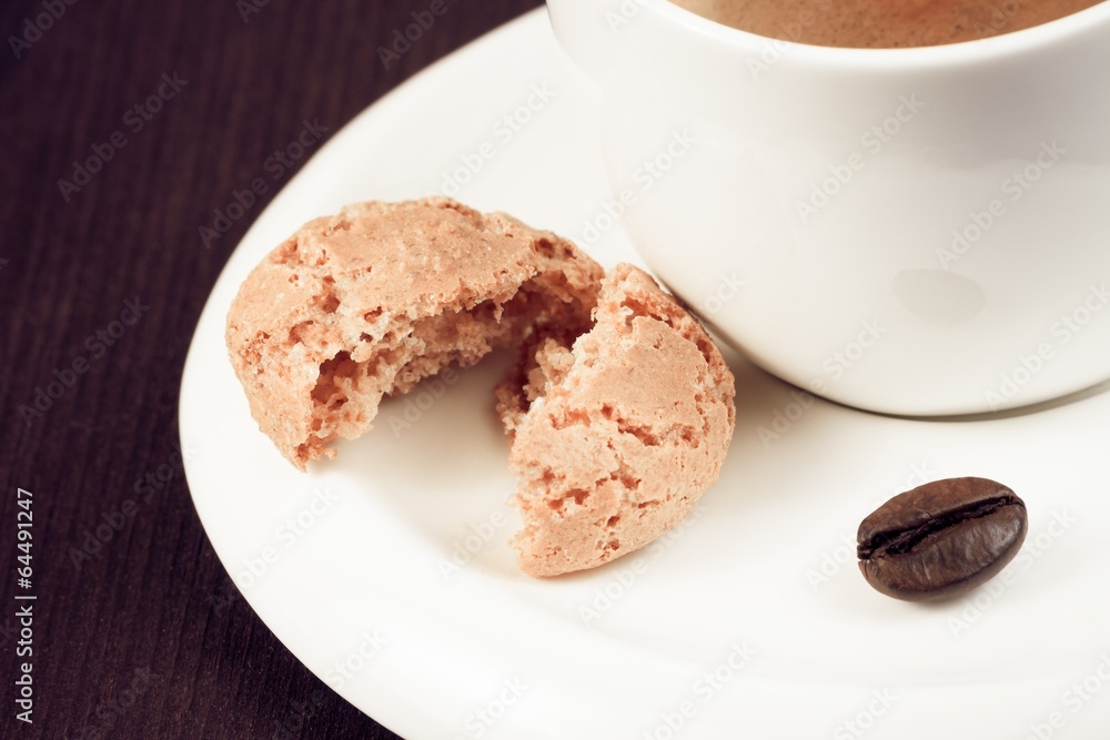 cup of italian espresso coffee and biscuit near coffee bean cup of italian espresso coffee and biscuit near coffee bean
