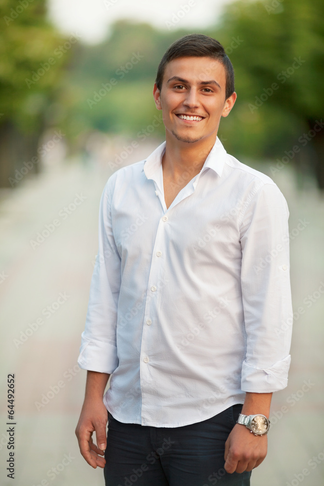 Portrait of a young Caucasian man outdoors