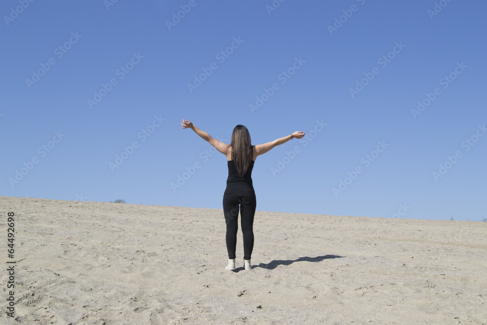 Woman working out on sand (beach, desert, freedom) Woman working out on sand (beach, desert, freedom)
