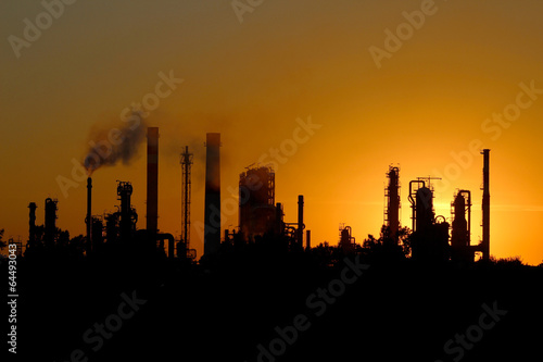 silhouette of ibig oil refinery factory  during sunset