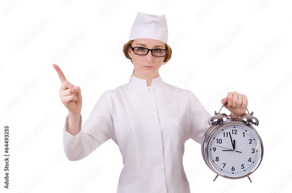 Attractive woman doctor with big clock pressing virtual buttons Attractive woman doctor with big clock pressing virtual buttons