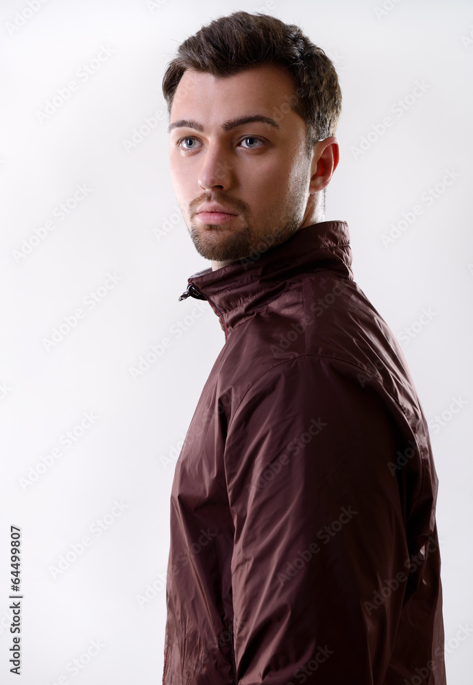 Obraz premium Portrait of handsome young man, on gray background