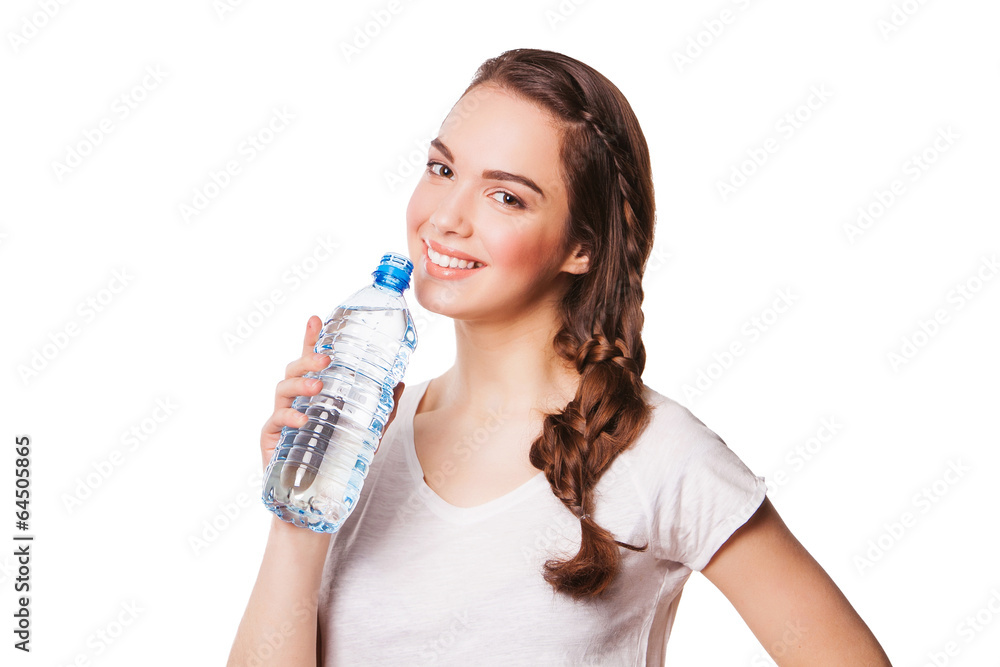 Beautiful girl drinking water from blue bottle Beautiful girl drinking water from blue bottle