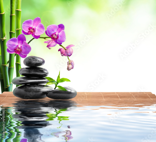 spa background whit bamboo , orchids and water