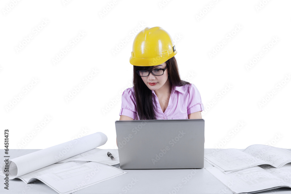 Asian architect using laptop in office isolated Asian architect using laptop in office isolated
