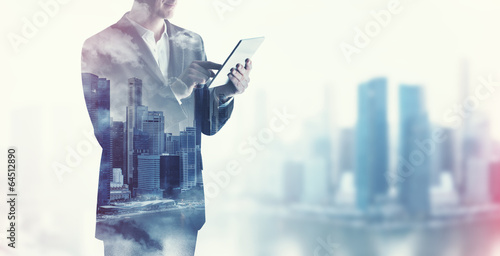 double exposure of businessman and city photo