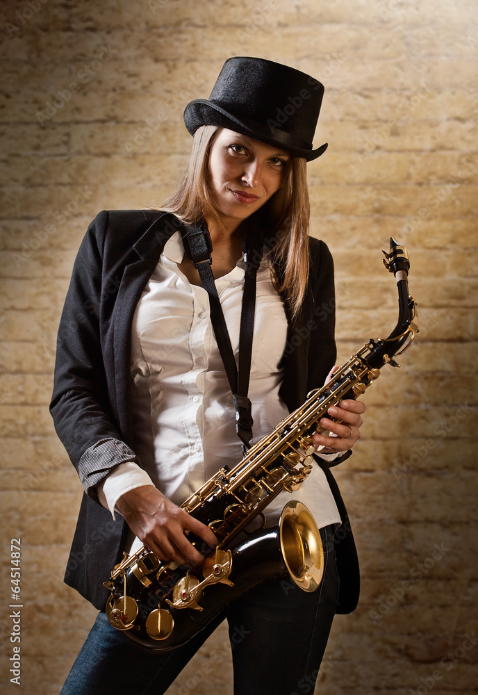 Naklejka premium young beautiful woman with saxophone