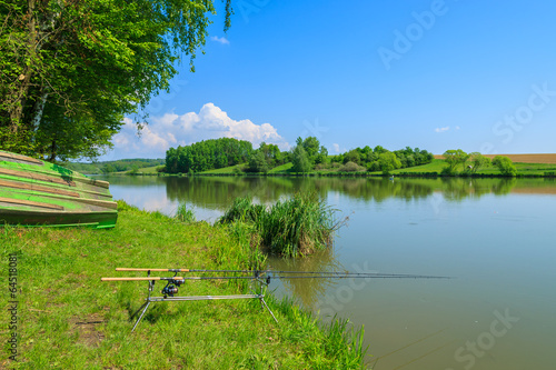 Fishing rod at lake shore in spring, Austria