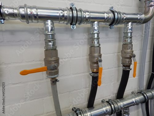 Close up of plumbing pipes on a wall