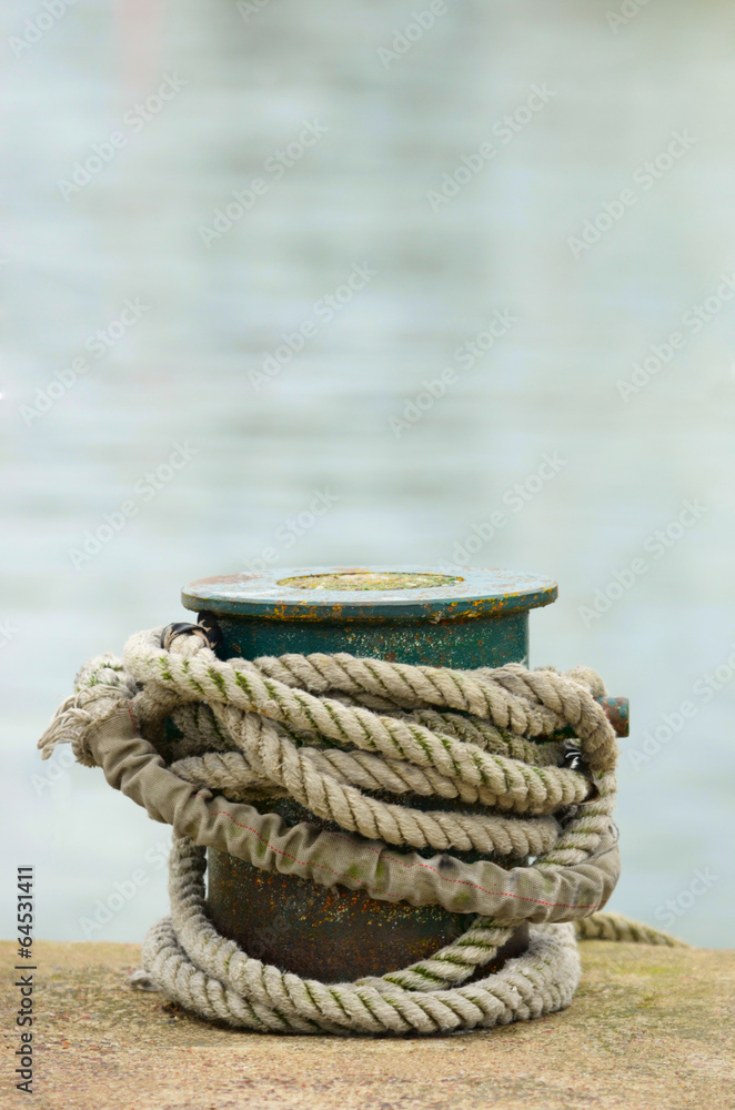 Fototapeta premium ship rope knotted around a bollard