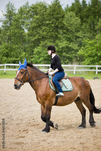young girl riding a horse