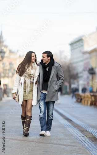 Young couple walking on the...