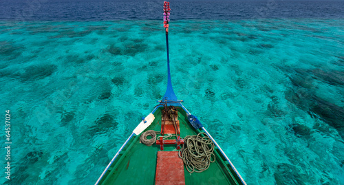 Traditional maldivian boat dhoni photo