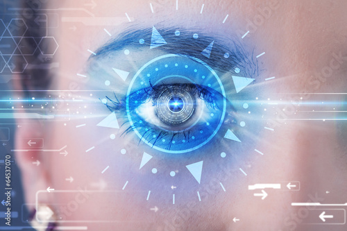 Fototapeta Naklejka Na Ścianę i Meble -  Cyber girl with technolgy eye looking into blue iris