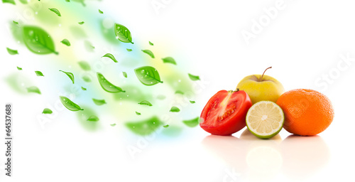 Colorful fruits with green organic leafs