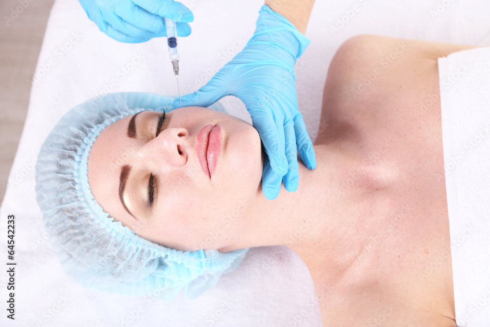 Naklejka premium Woman in beauty clinic getting botox injection,