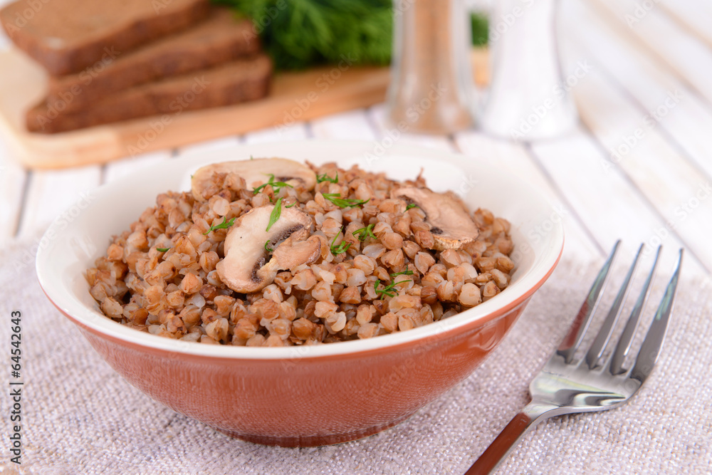 Boiled buckwheat in bowl on table close-up Boiled buckwheat in bowl on table close-up