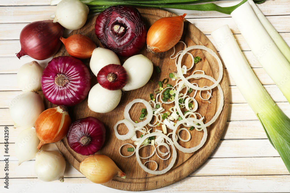 Different raw onion on wooden background Different raw onion on wooden background