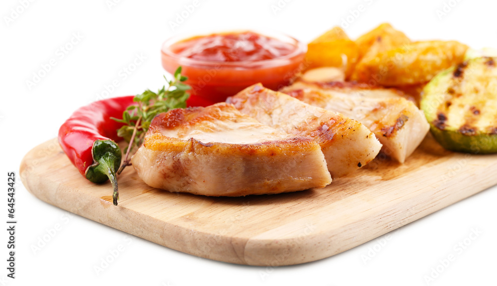 Grilled steak with fried potato pieces and grilled vegetables Grilled steak with fried potato pieces and grilled vegetables