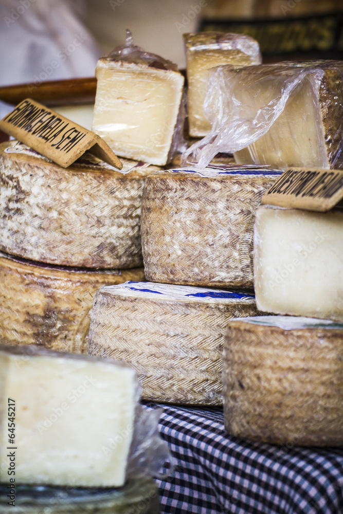 batch of cheese in a medieval fair, artisan cheese batch of cheese in a medieval fair, artisan cheese