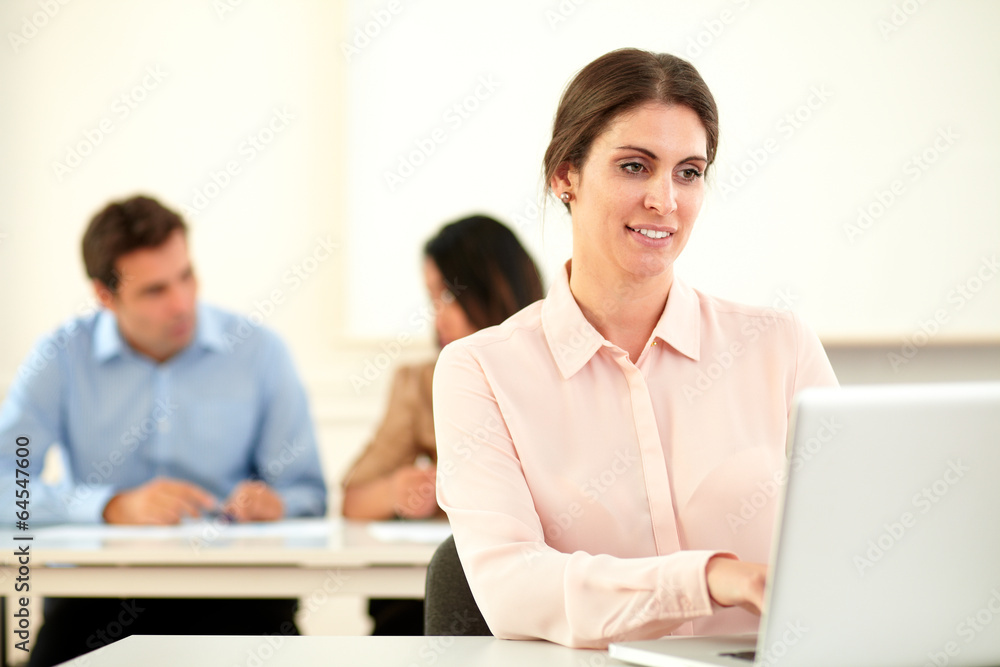 Atttractive young woman working on her laptop Atttractive young woman working on her laptop