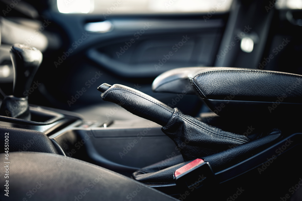 interior modern car elements, close-up of handbrake and seatbelt