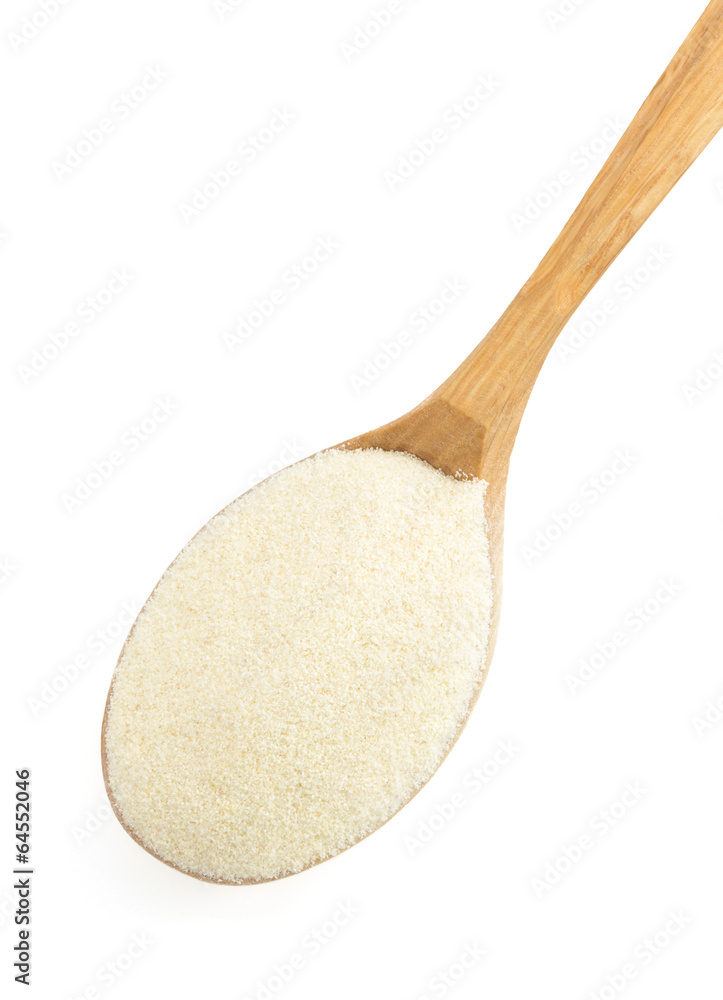 semolina in spoon on white semolina in spoon on white