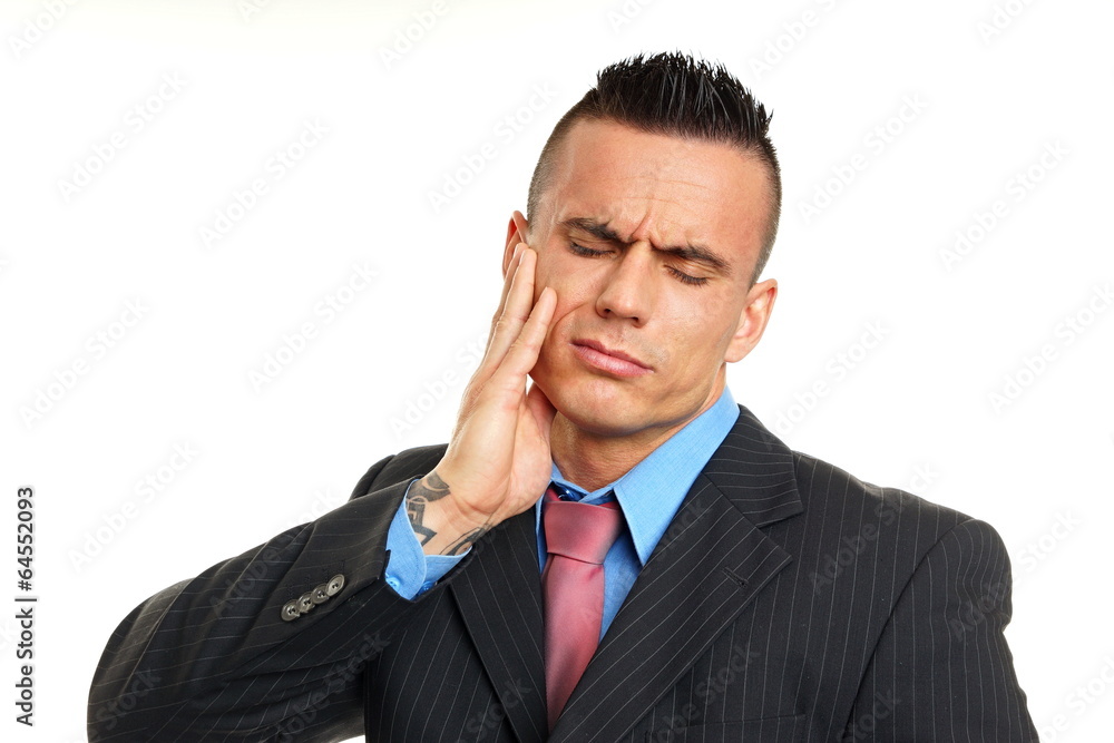 Young man holding your face because suffering from a toothache Young man holding your face because suffering from a toothache