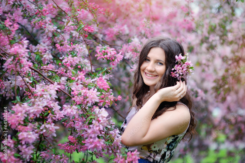 Beautiful girl in spring park with flowers Beautiful girl in spring park with flowers