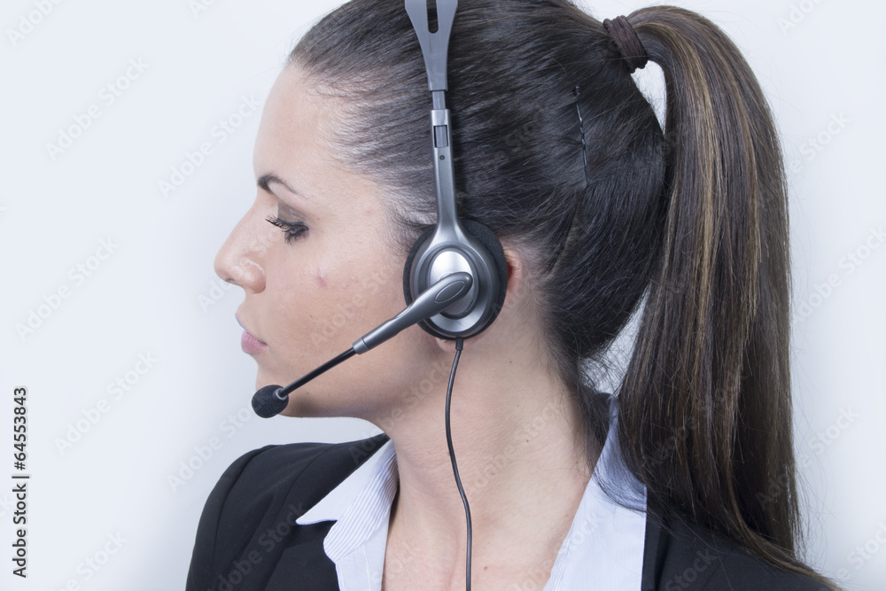 Business woman with headphones (headset, office) Business woman with headphones (headset, office)