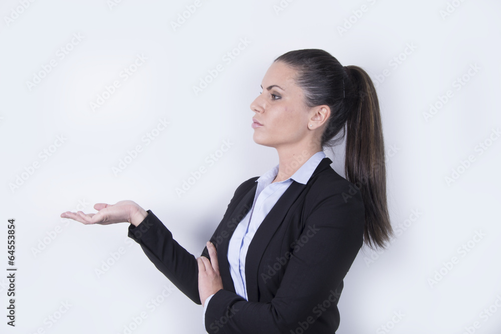 Young beautiful business woman showing something Young beautiful business woman showing something
