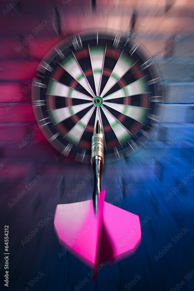 Obraz premium Dart about to hit target with dramatic lighting