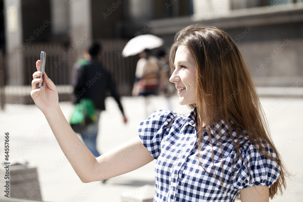 Fototapeta premium woman reading a message on the phone