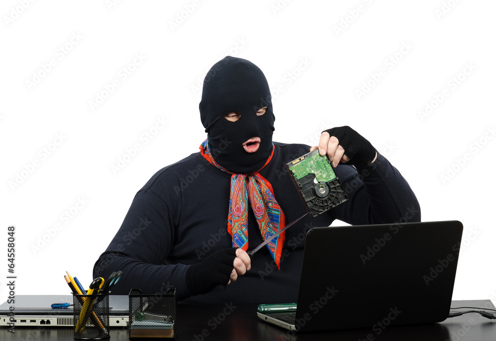 Robber holding in one hand a hard drive Robber holding in one hand a hard drive