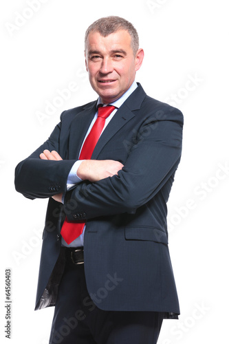 business man holds his arms folded