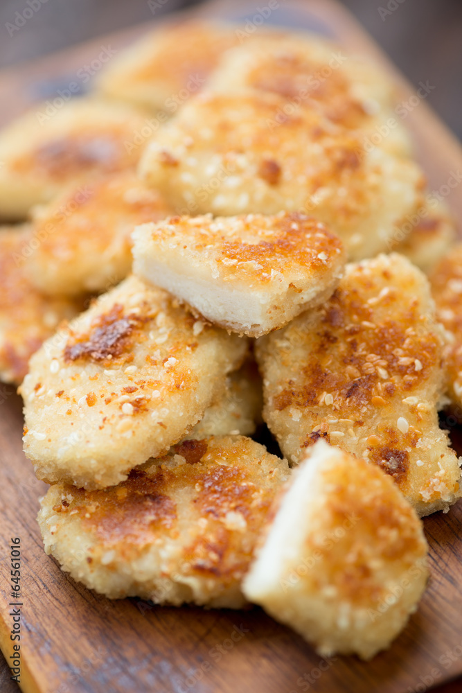 Sesame chicken nuggets, close-up, studio shot Sesame chicken nuggets, close-up, studio shot