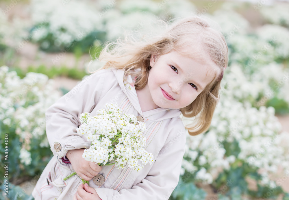Adorable little girl holding a bouquet Adorable little girl holding a bouquet