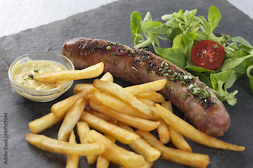 grilled sausage and french fries with salad