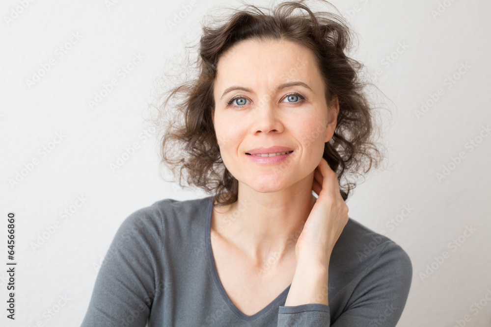 Romantic woman looking into camera with smile Romantic woman looking into camera with smile