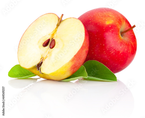 Red apples and half with green leaves isolated on a white backgr