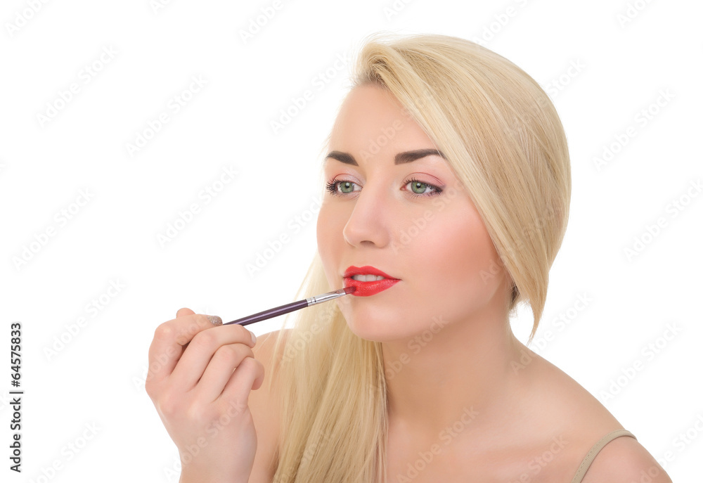 woman applying lipstick using lip concealer brush woman applying lipstick using lip concealer brush