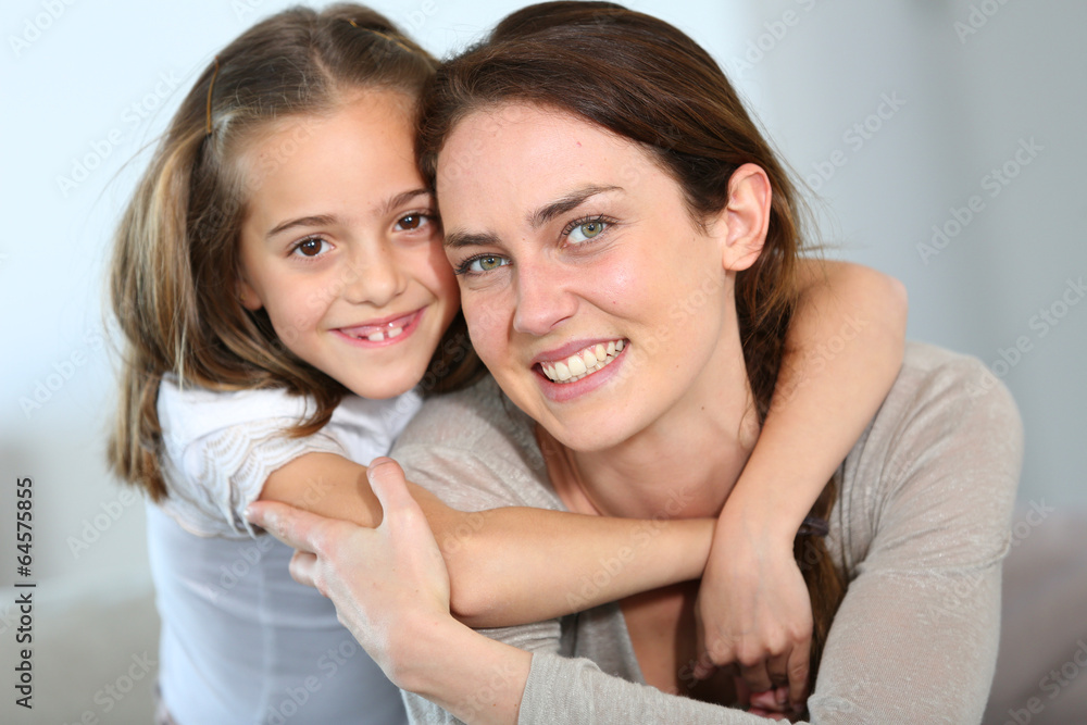 Portrait of mother and daughter in tender moment Portrait of mother and daughter in tender moment