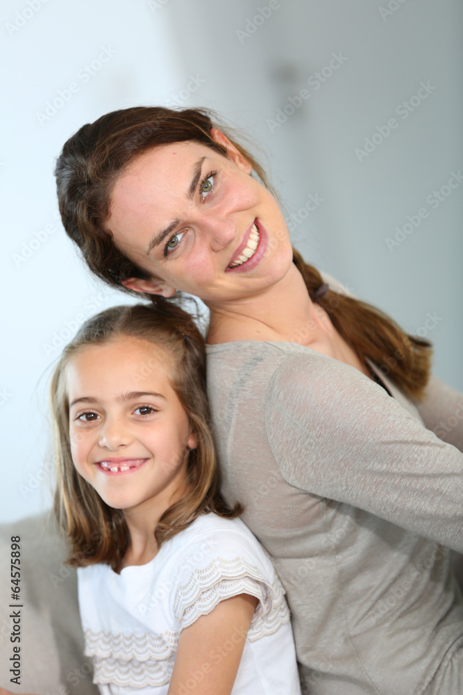 Portrait of mother and daughter in tender moment Portrait of mother and daughter in tender moment