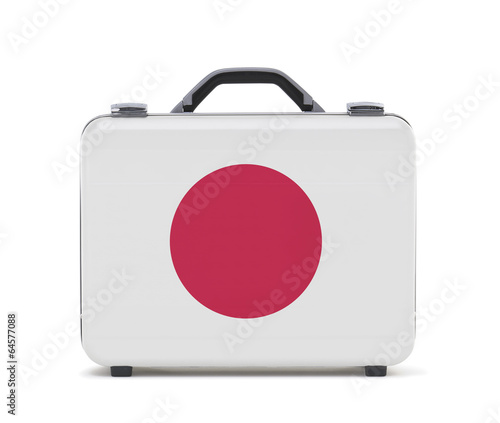 Business suitcase for travel with flag of Japan photo