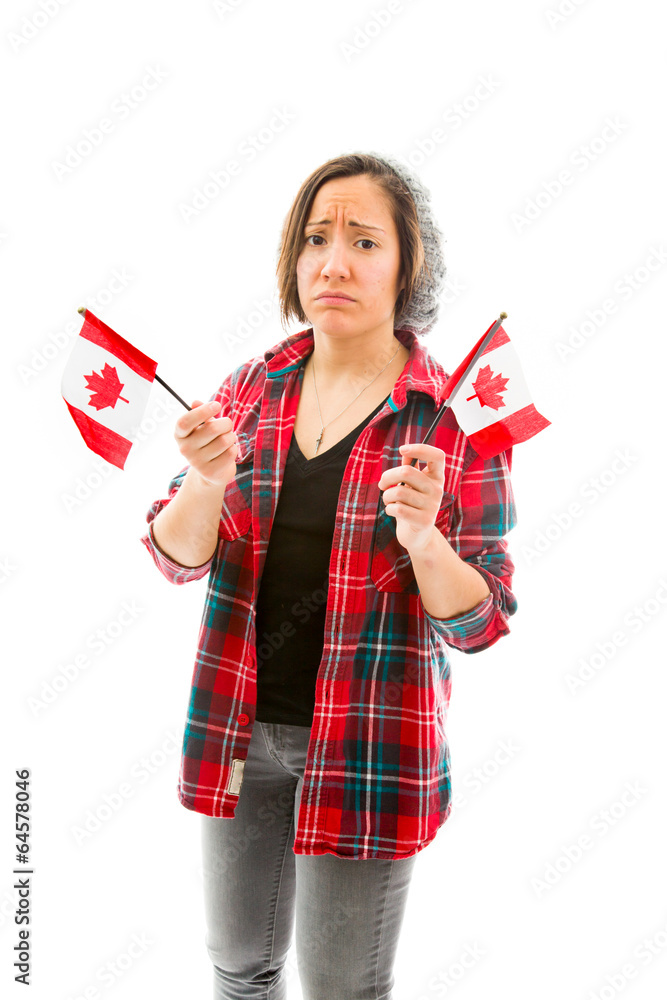 Young woman looking sad and holding Canada flag Young woman looking sad and holding Canada flag