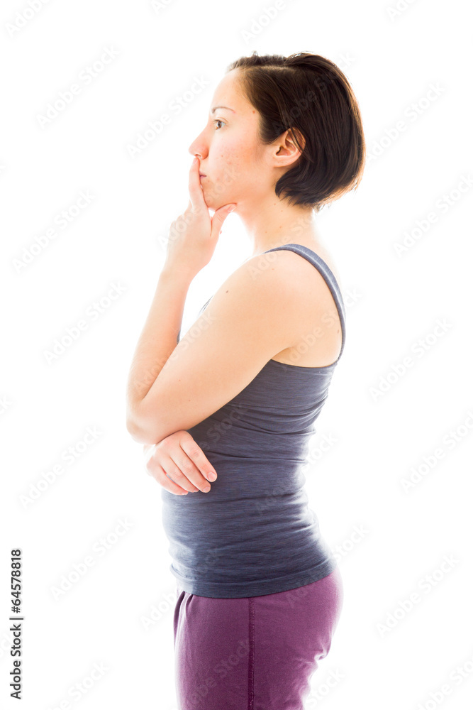 Side profile of a young woman thinking with hand on chin Side profile of a young woman thinking with hand on chin