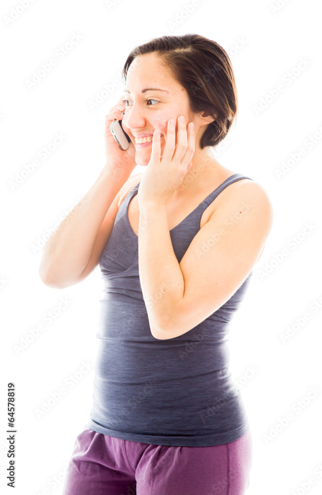 Young woman talking on mobile phone and smiling Young woman talking on mobile phone and smiling