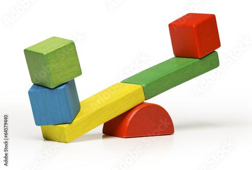 toys seesaw wooden blocks, teeter totter isolated on white photo