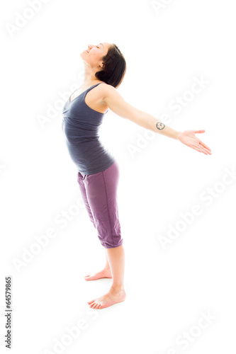 Young woman standing with her arm outstretched